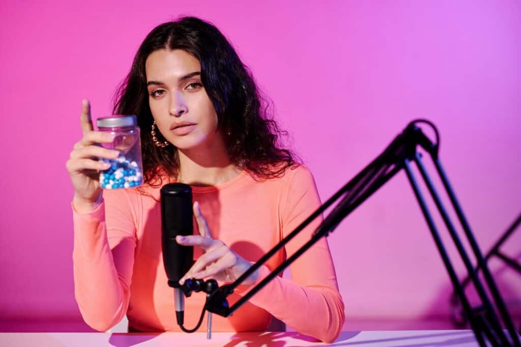 woman recording ASMR videos in front of microphone